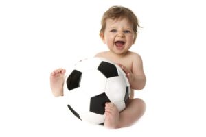 Criança com bola - férias na Copa do Mundo